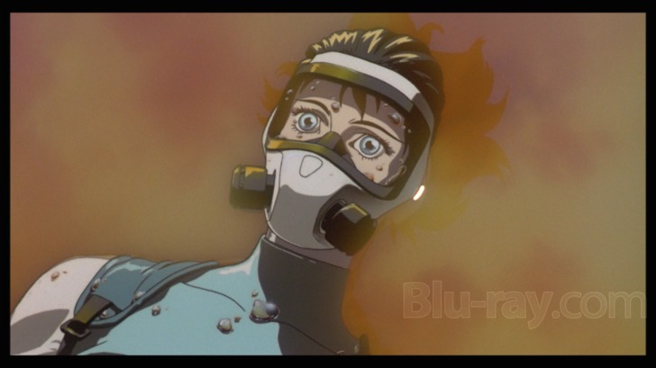 Film frame: the Major in a diving mask breaking the surface