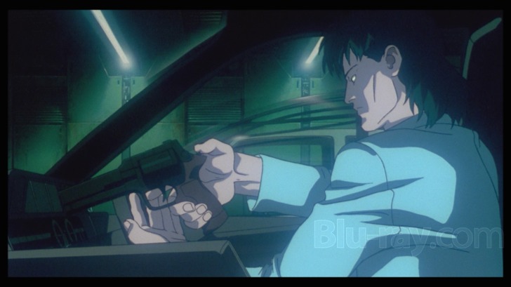 Film frame: an operative loading a weapon inside a vehicle